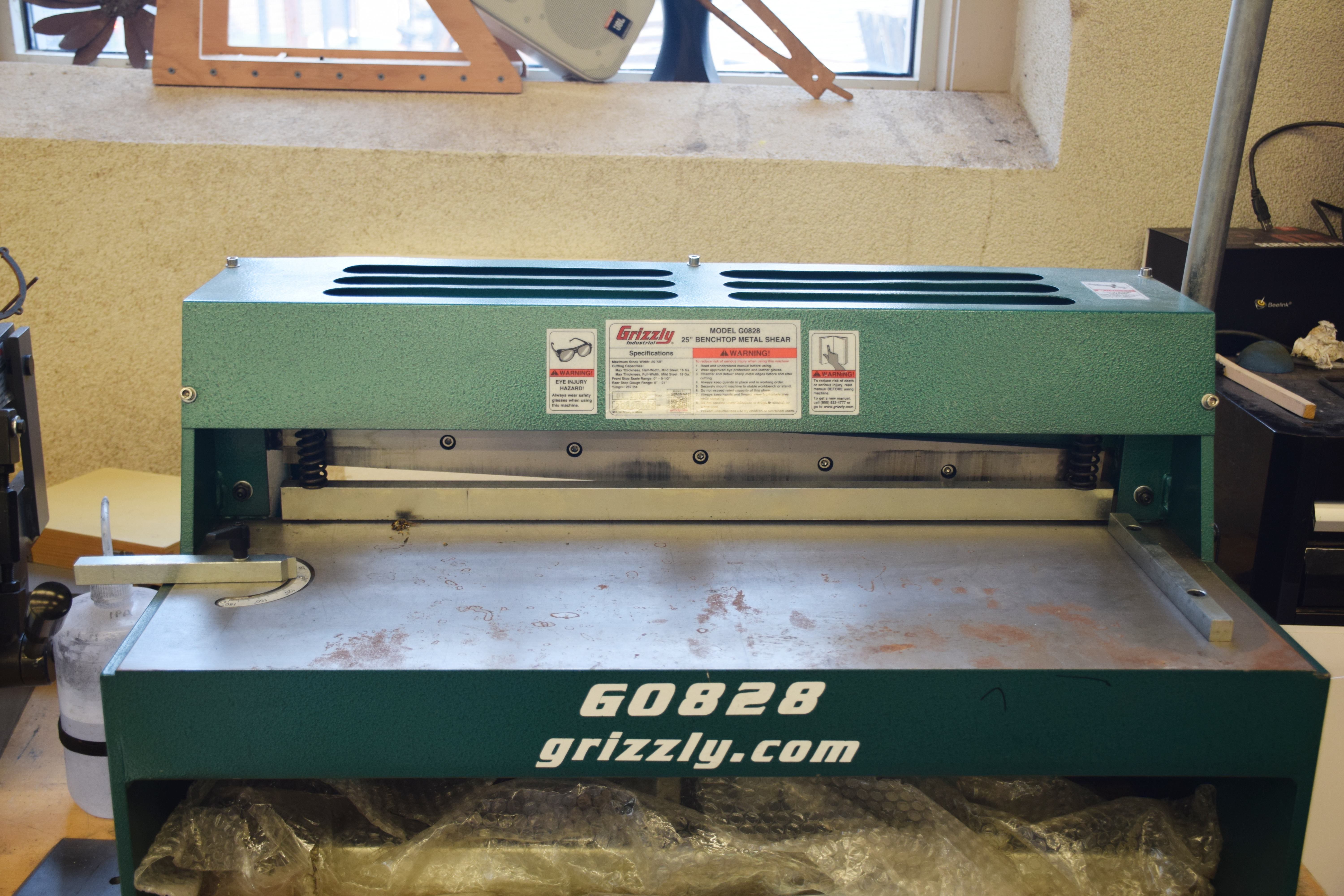 Green Metal Guillotine on Table