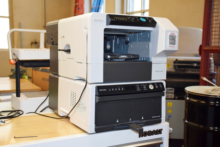 Small White T-shirt Printer on a Table