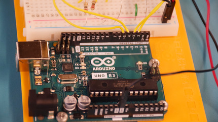 Close up of Arduino Connected to Breadboard