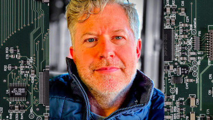 Brian Slocum Headshot with Circuit Background