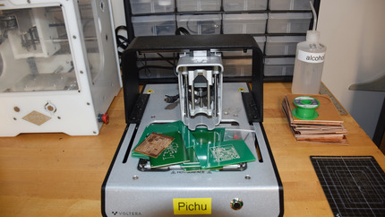 Front View of PCB Printer with Printed Circuits on it